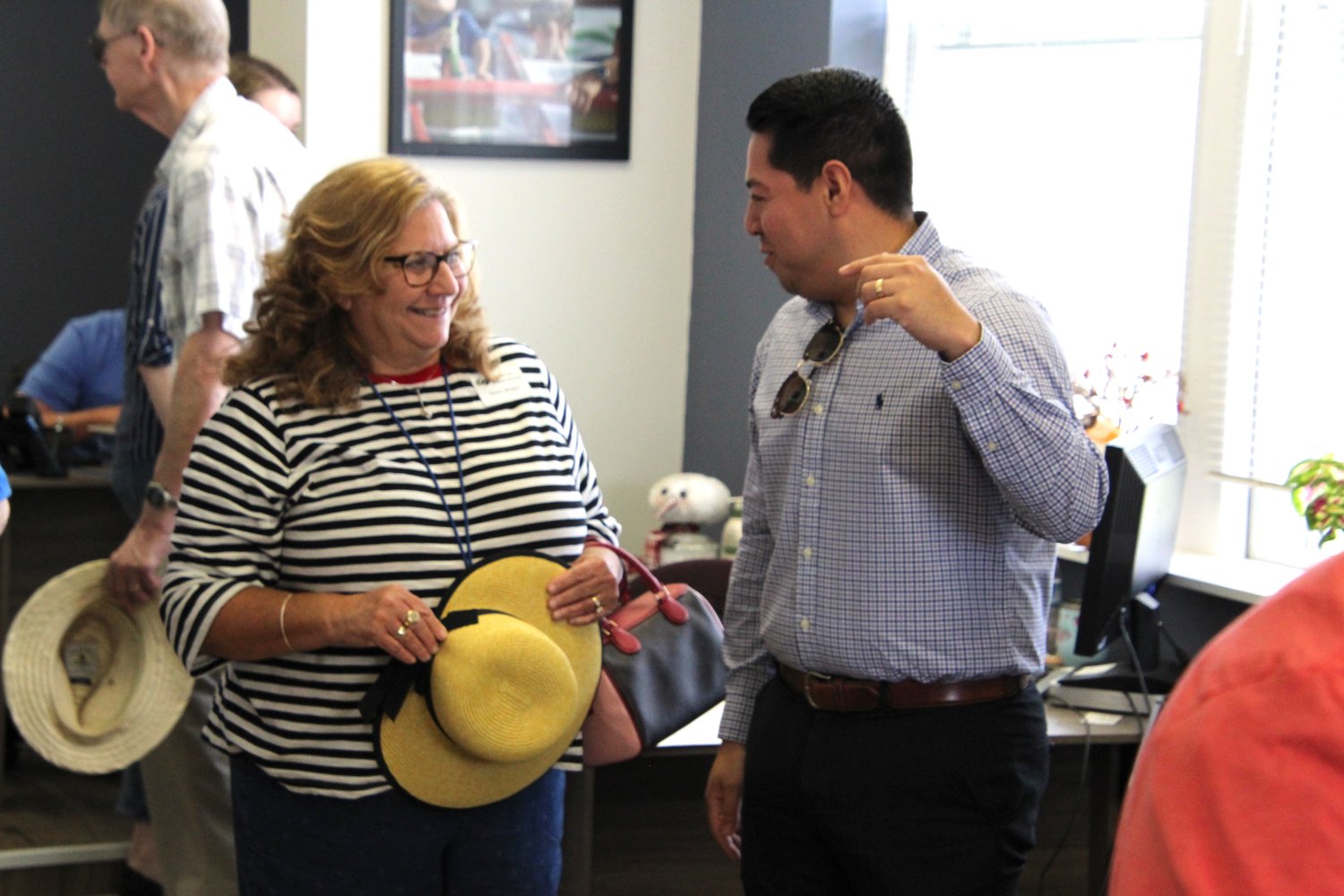 Center for Human Services Director of Development Susan Mergen and Pettis County Eastern Commissioner Israel Baeza talk during the Democrat’s open house on June 10.